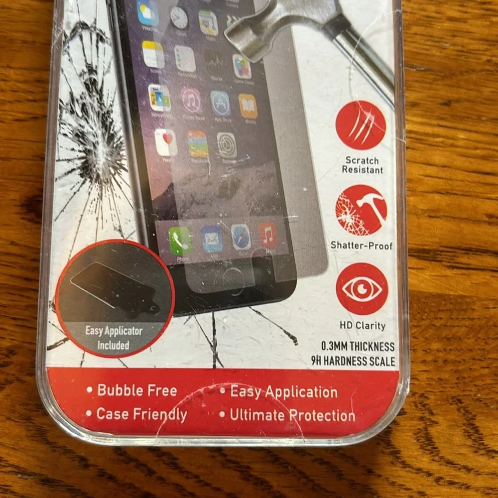 NWT. (New with tape intact). Never opened. Tempered glass iPhone 6/6s