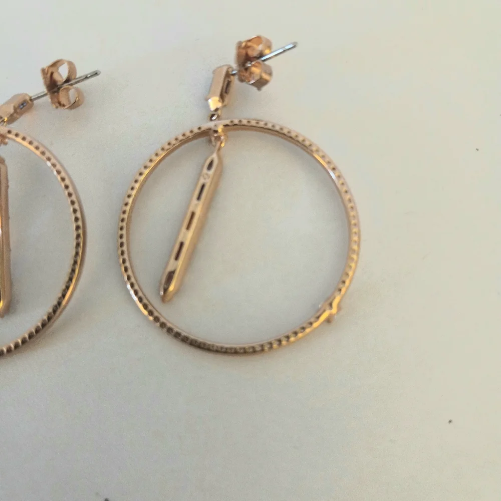 Nadri rose gold multi color prism circle drop earrings.