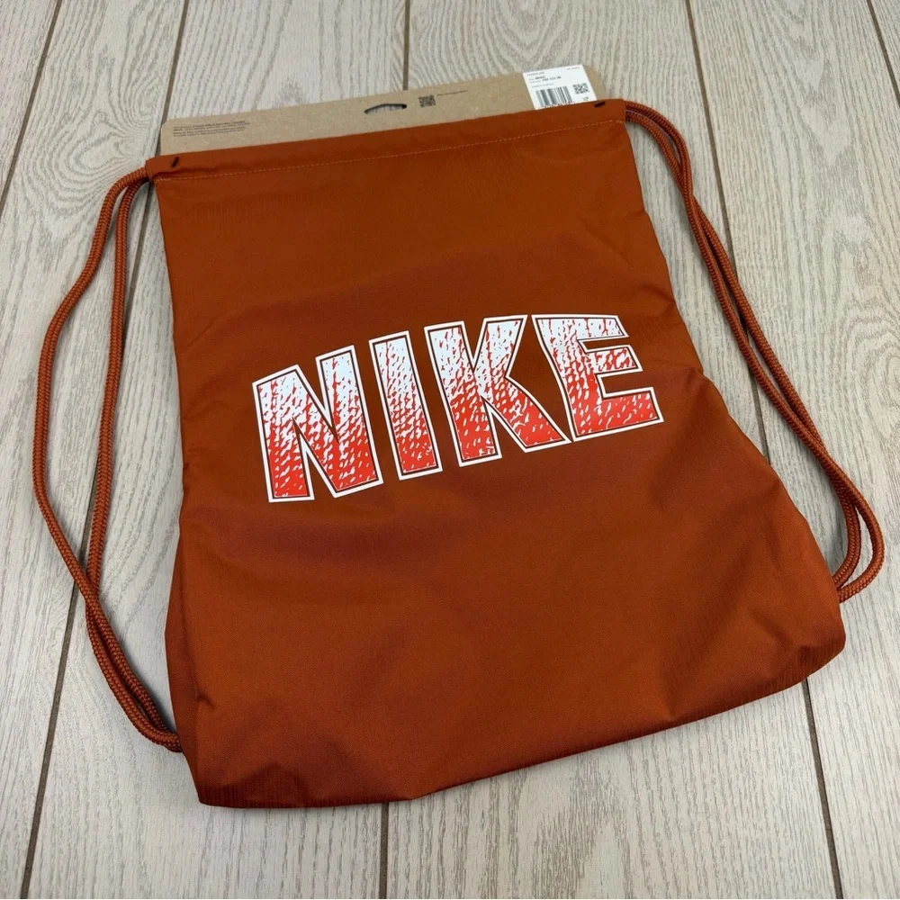 Nike Kids Drawstring Bag (12L) One Size Medium Orange Ombre Graphic $21