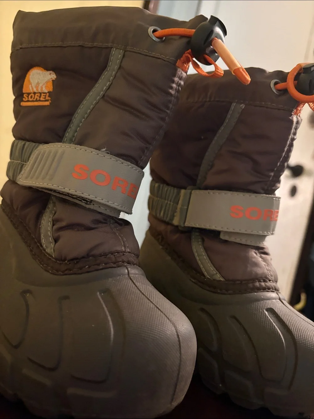 Sorel Brown Kids Winter Boots with Orange Accents