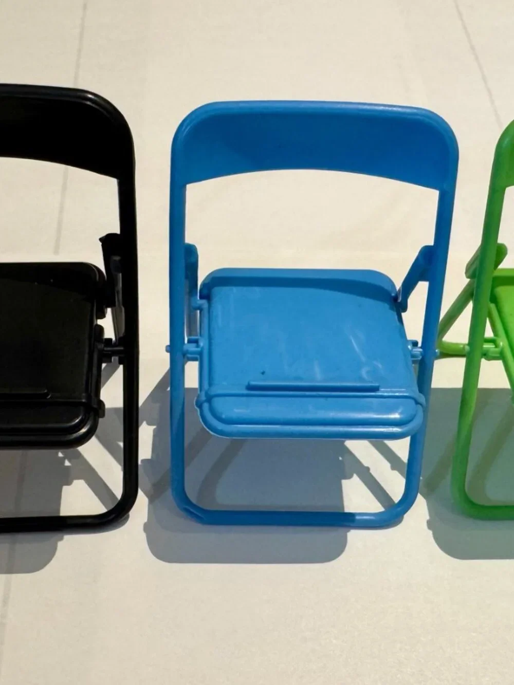 Yellow Plastic Folding Chair Cell Phone Stand