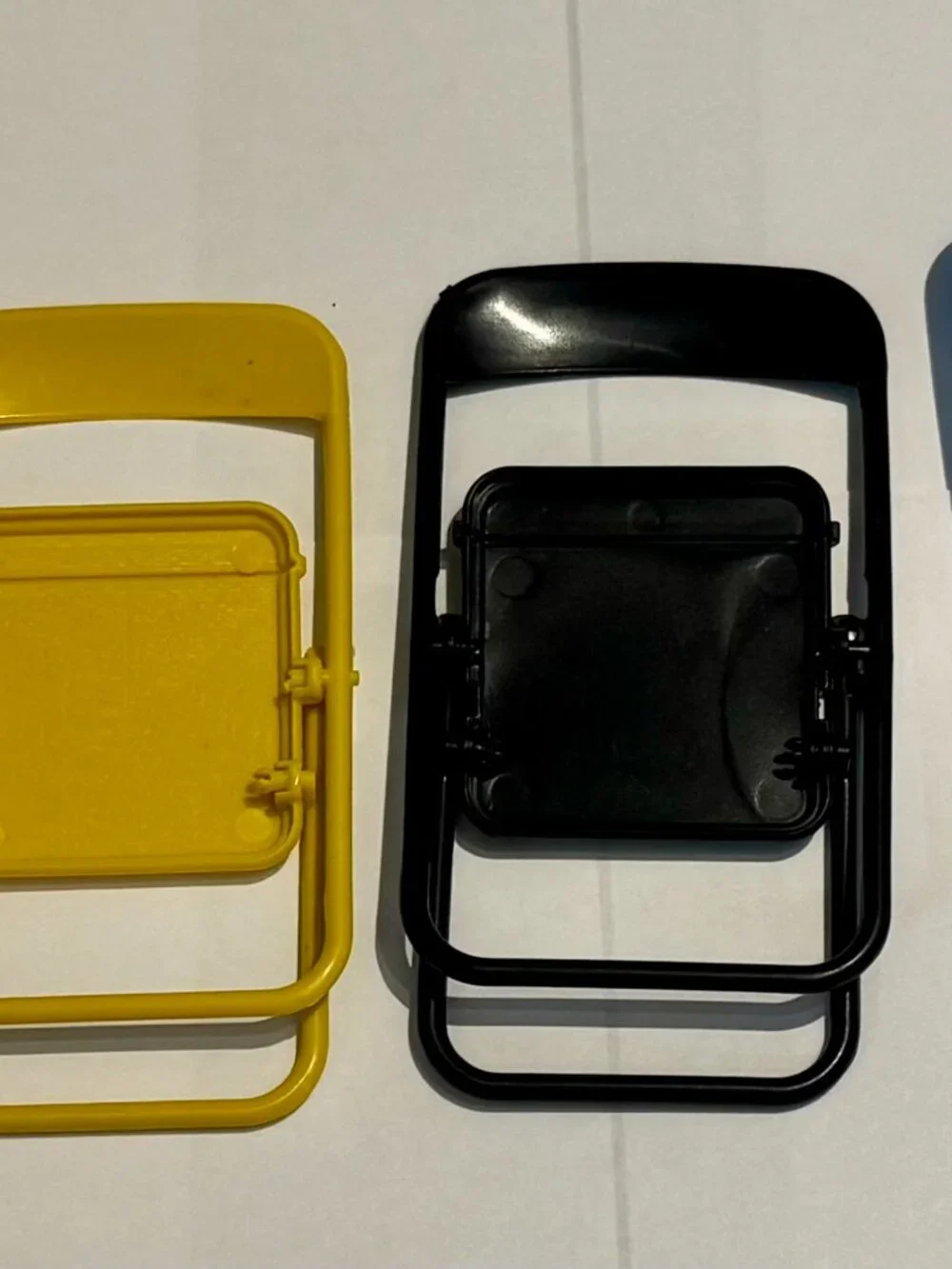 Yellow Plastic Folding Chair Cell Phone Stand