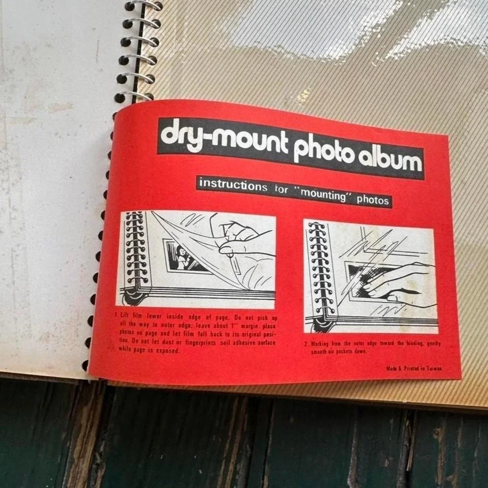 Brown dry-mount photo album with instructions for mounting photos