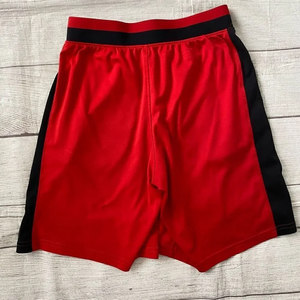 Under Armour youth boys M loose fit heatgear pull on athletic shorts red&black