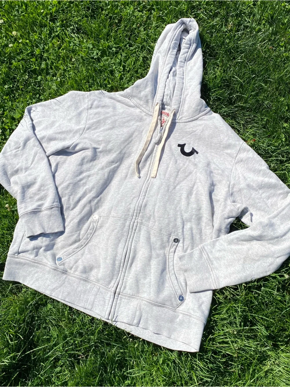 True Religion Light Gray Zip Hoodie with Black Logo Patch