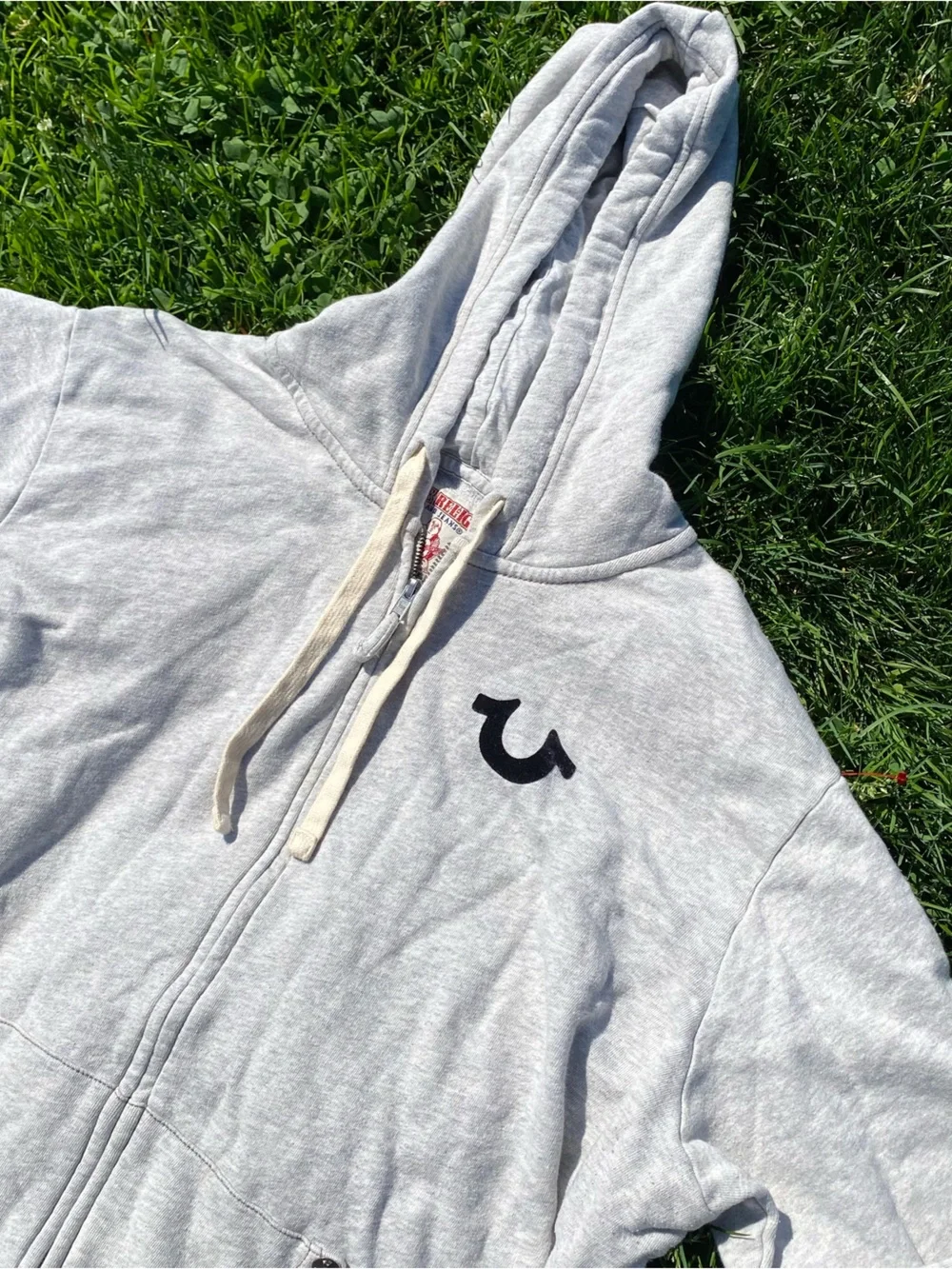 True Religion Light Gray Zip Hoodie with Black Logo Patch
