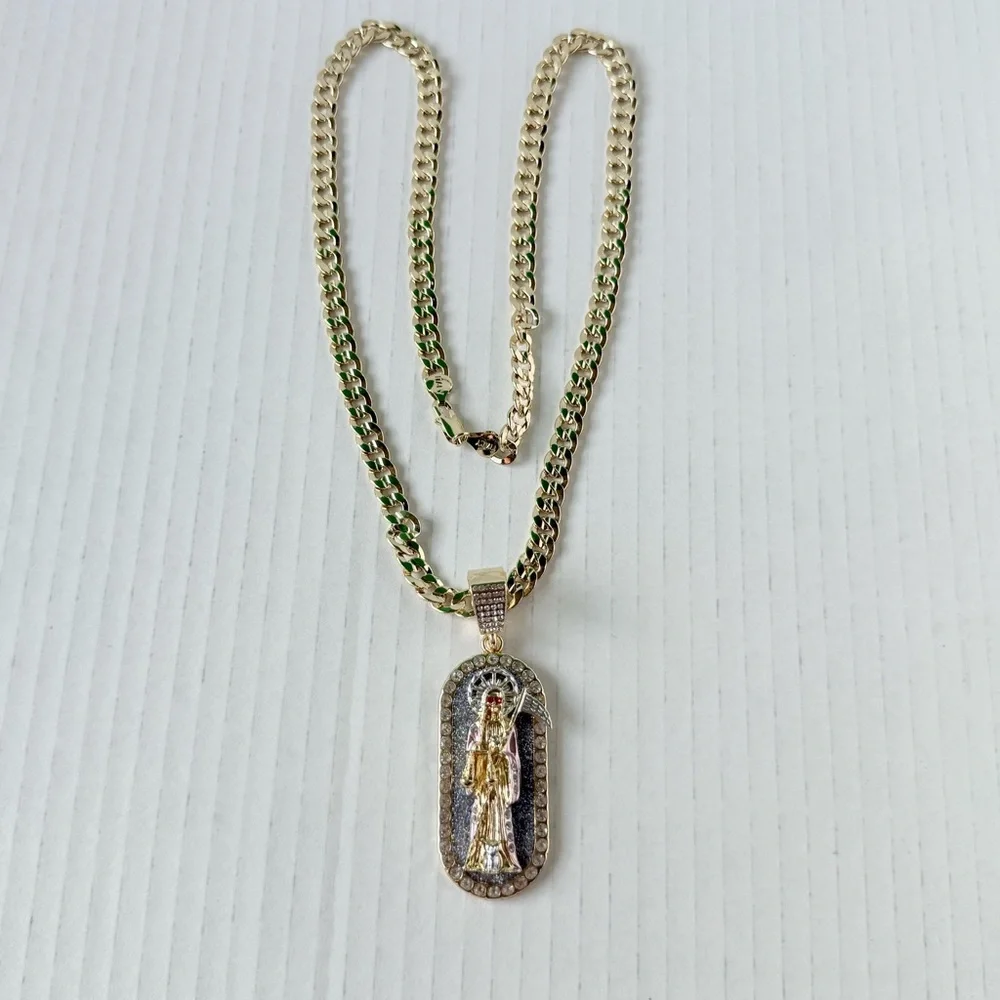 Chain‎ 24”of man with holy death medal. Laminated gold New