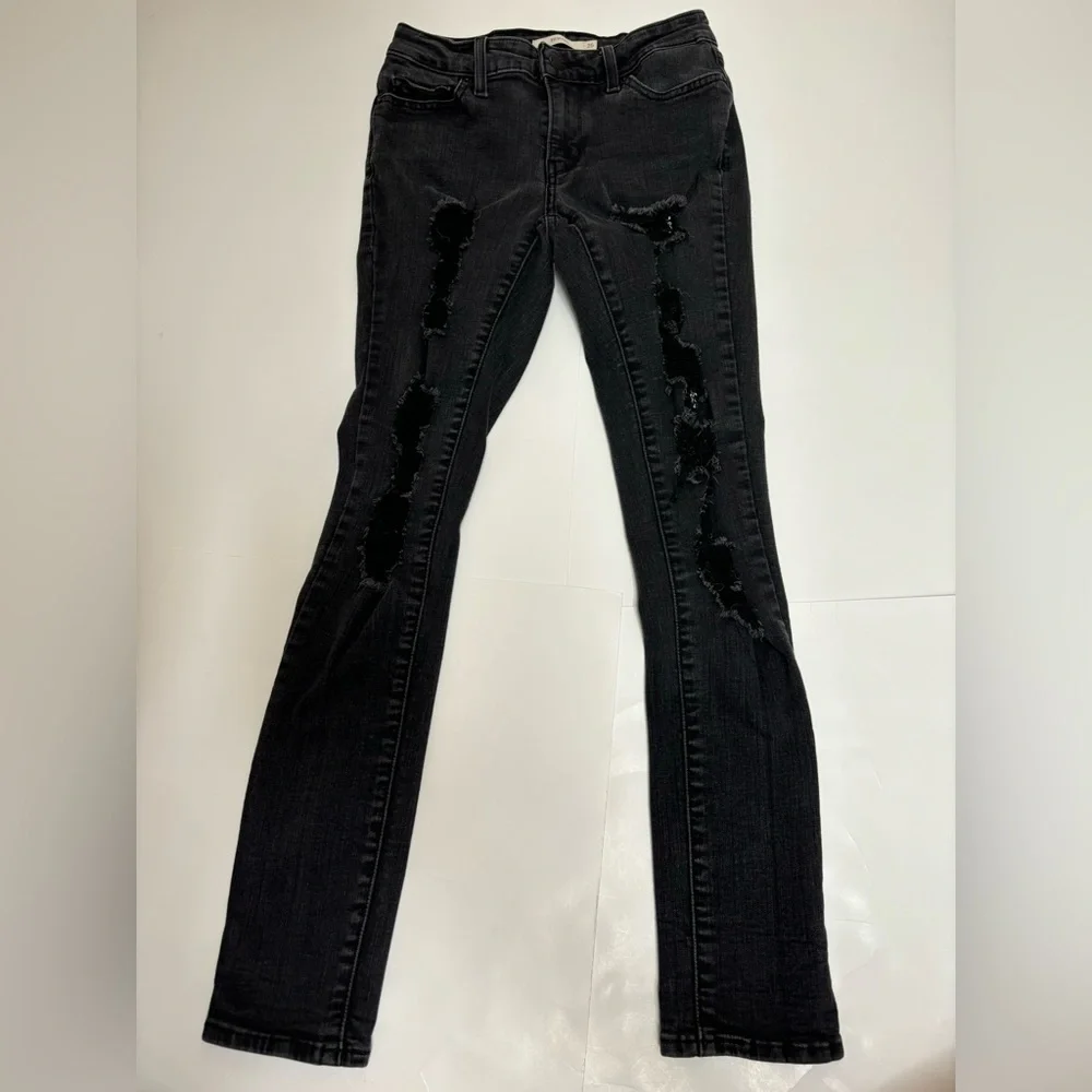 Levi’s 711 skinny black distressed‎ low rise jeans 26 ripped holes