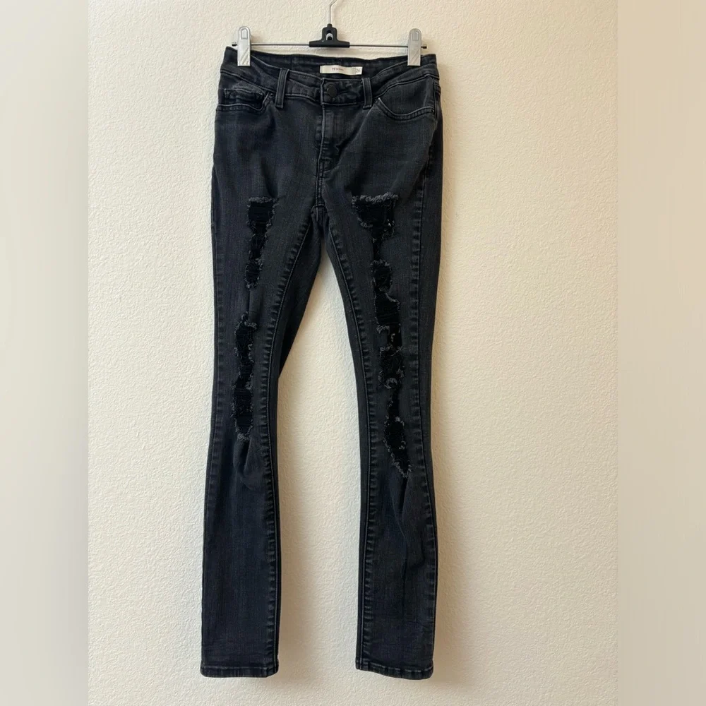 Levi’s 711 skinny black distressed‎ low rise jeans 26 ripped holes