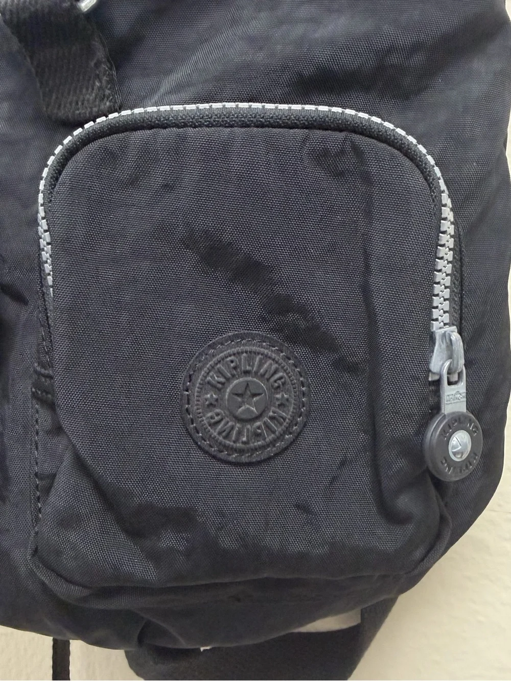 Kipling tag fabric