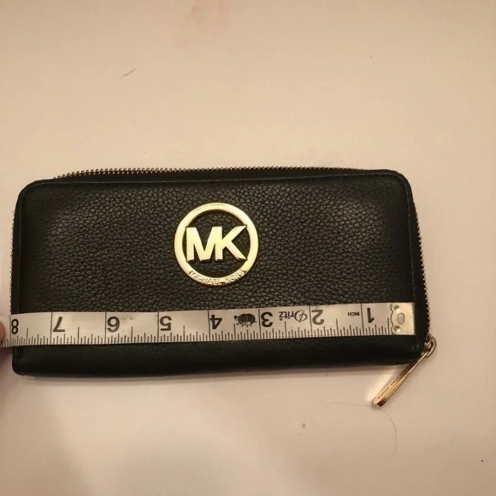 Michael Kors scuffs wallet wear