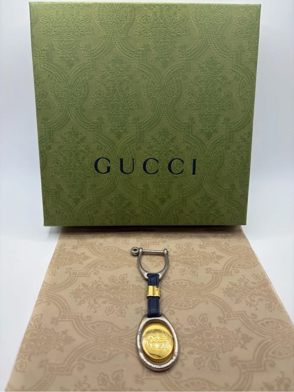 Gucci keys logo medallion