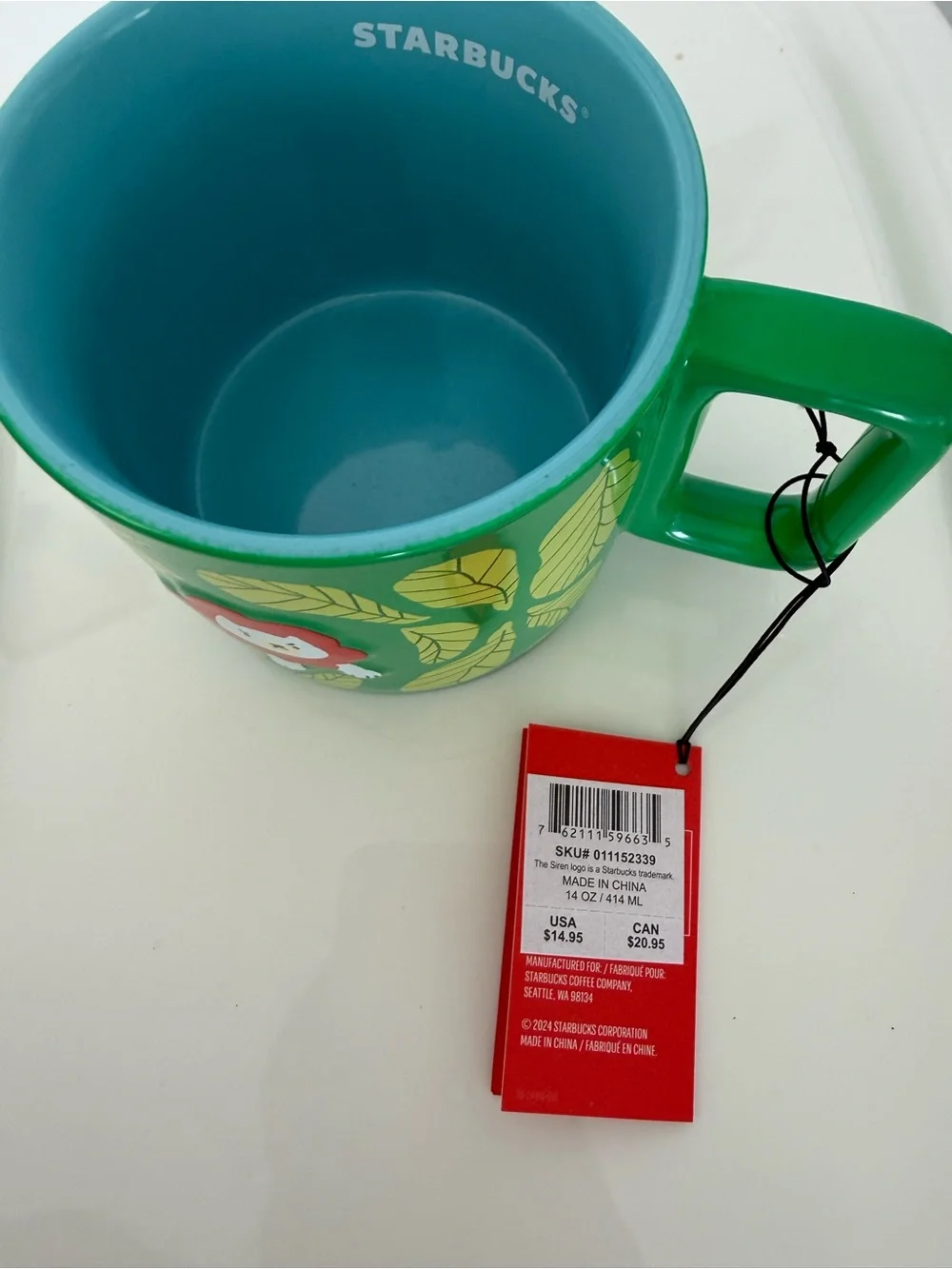 Starbucks Green and Teal Ceramic Mug with Leaf and Lion Motif
