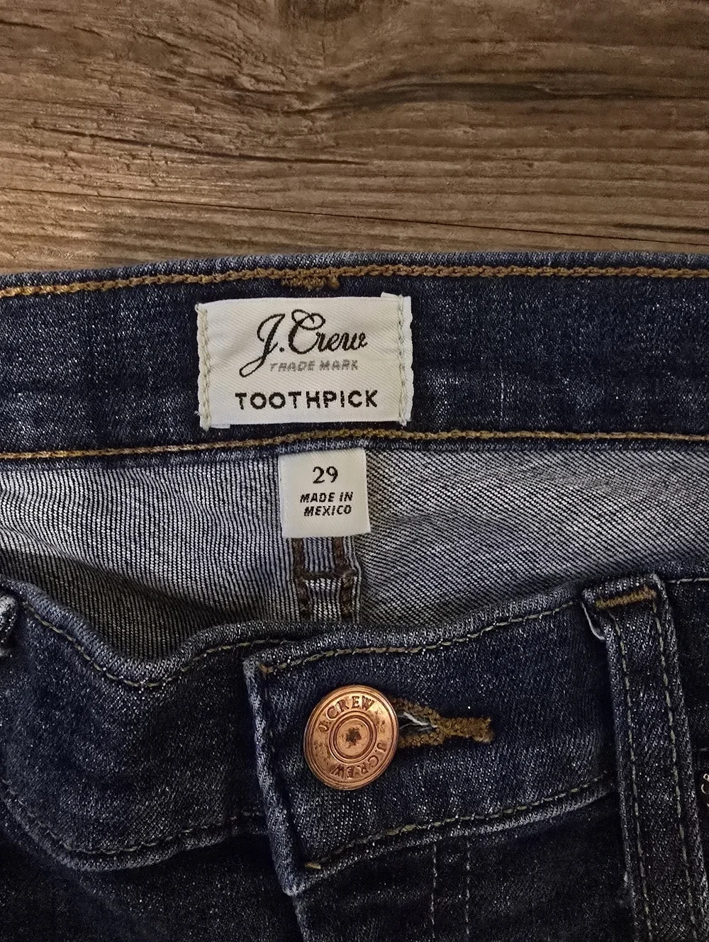 J. Crew Dark Blue Toothpick Skinny Jeans with Distressed Knee And Hem