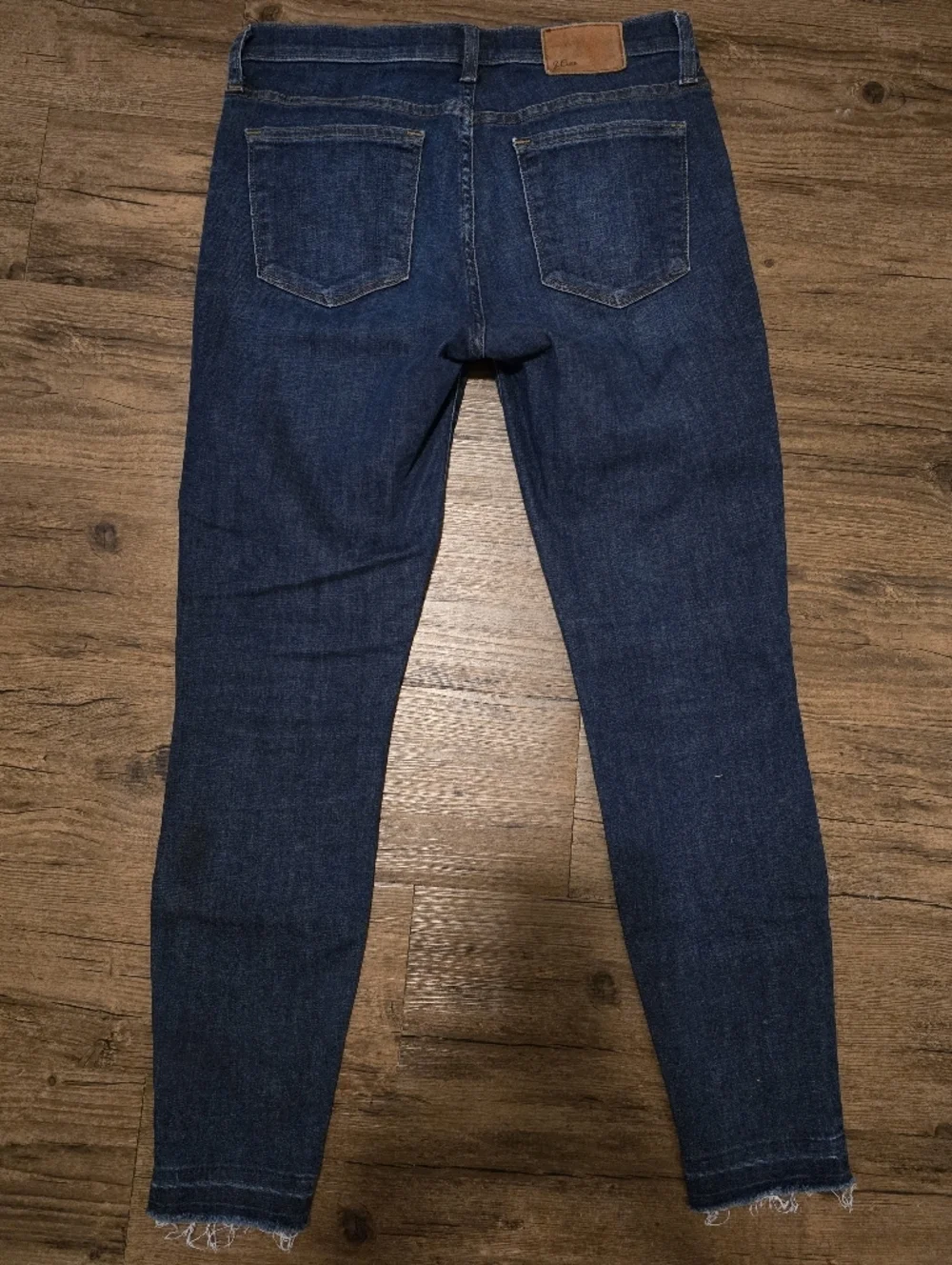 J. Crew Dark Blue Toothpick Skinny Jeans with Distressed Knee And Hem