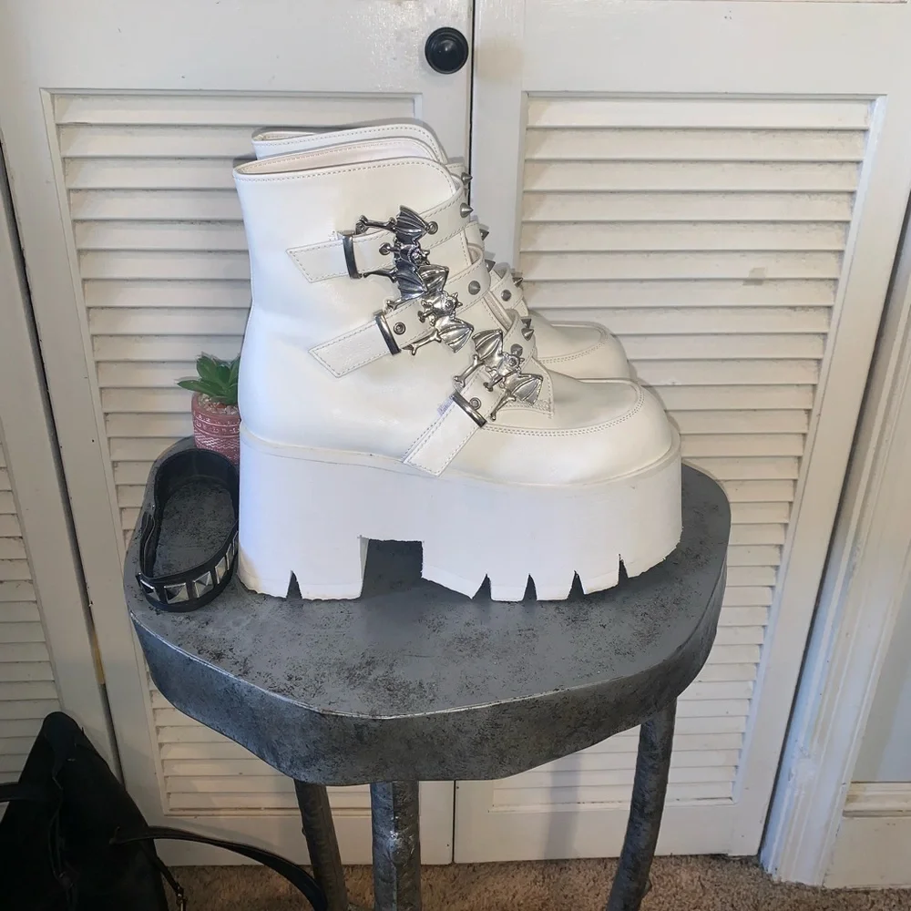 Demonia ASHES-55 white platform ankle boots featuring silver bat buckles 8.5