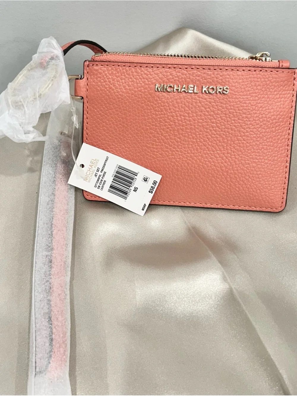 Michael Kors Coral Pink Pebbled Leather Mini Wristlet