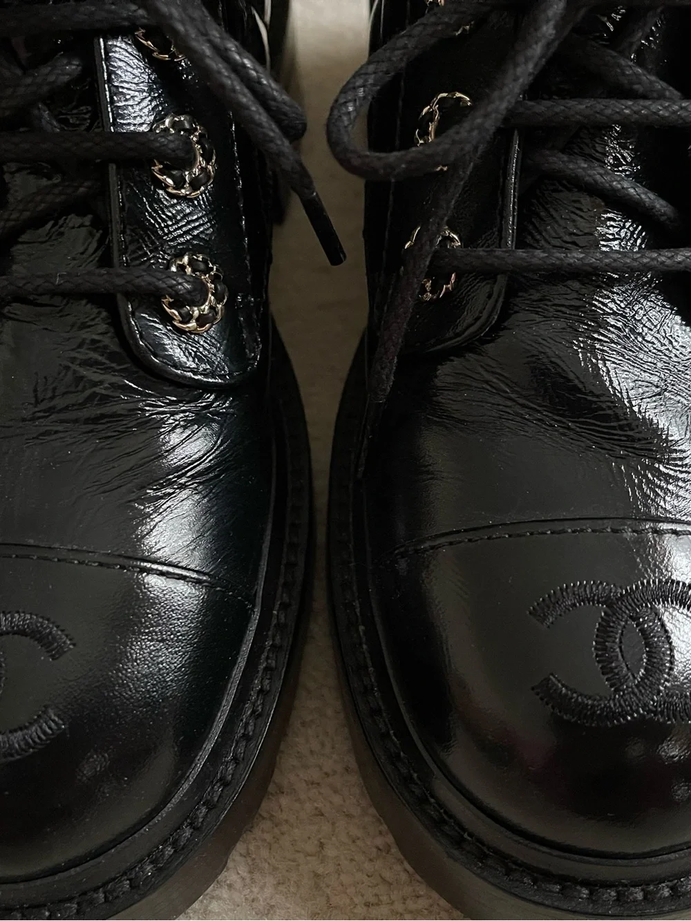 CHANEL Black Quilted Leather Lace-Up Combat Boots with Gold Chain CC.