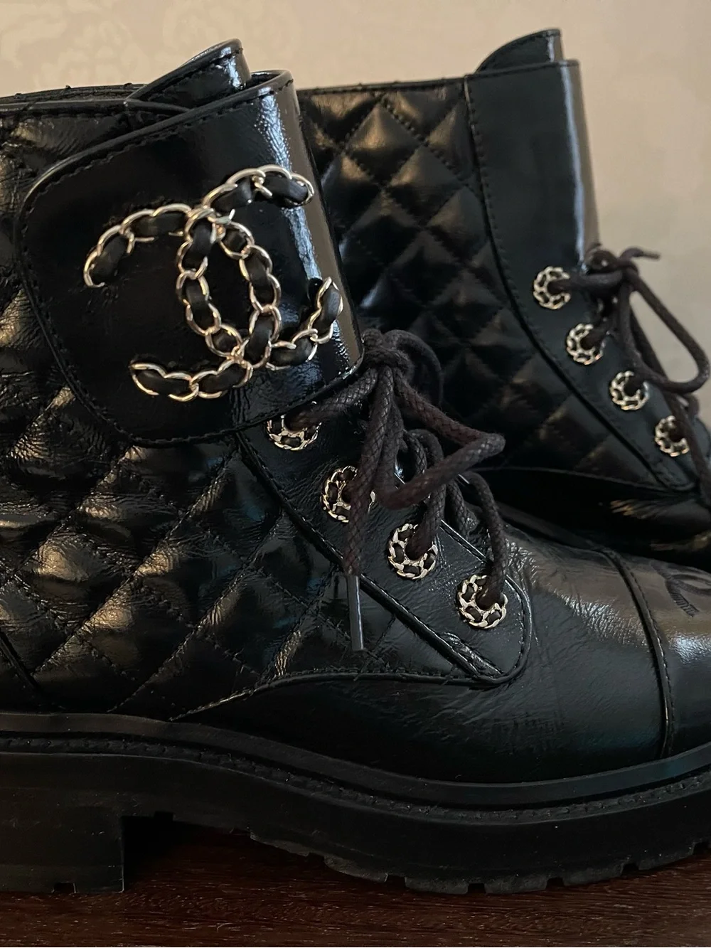 CHANEL Black Quilted Leather Lace-Up Combat Boots with Gold Chain CC.