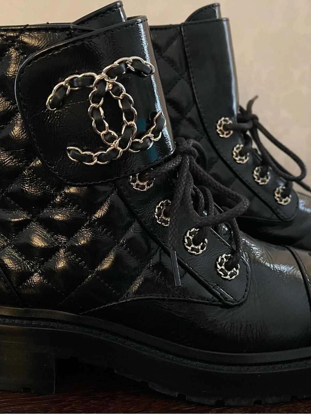 CHANEL Black Quilted Leather Lace-Up Combat Boots with Gold Chain CC.