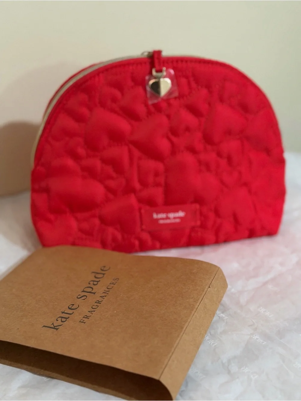 kate spade red quilted heart zip cosmetic pouch with gold-tone heart charm