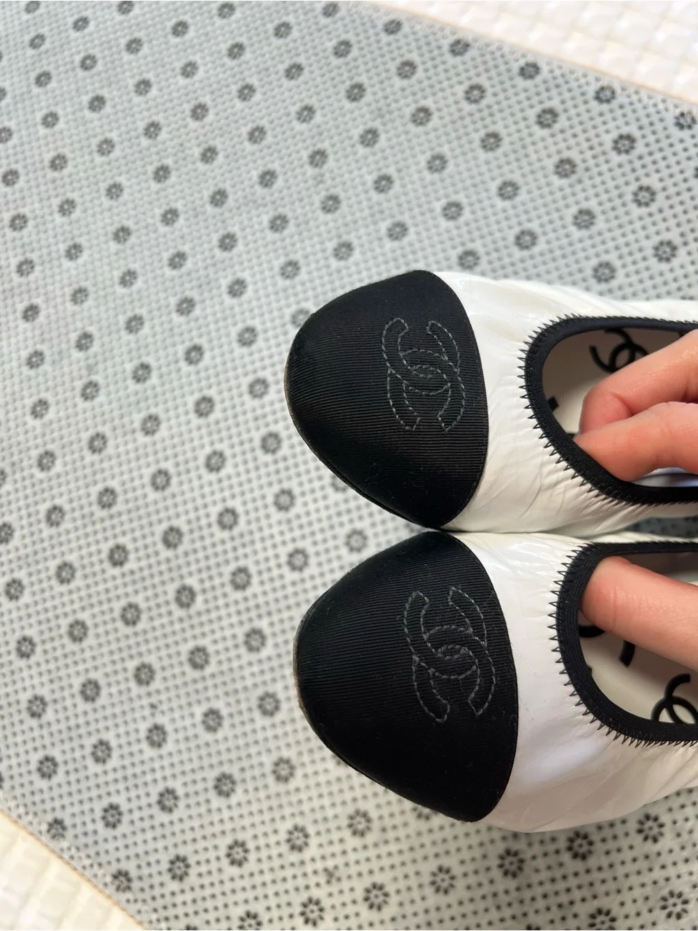 CHANEL White Ballet Flats with Black Cap Toe