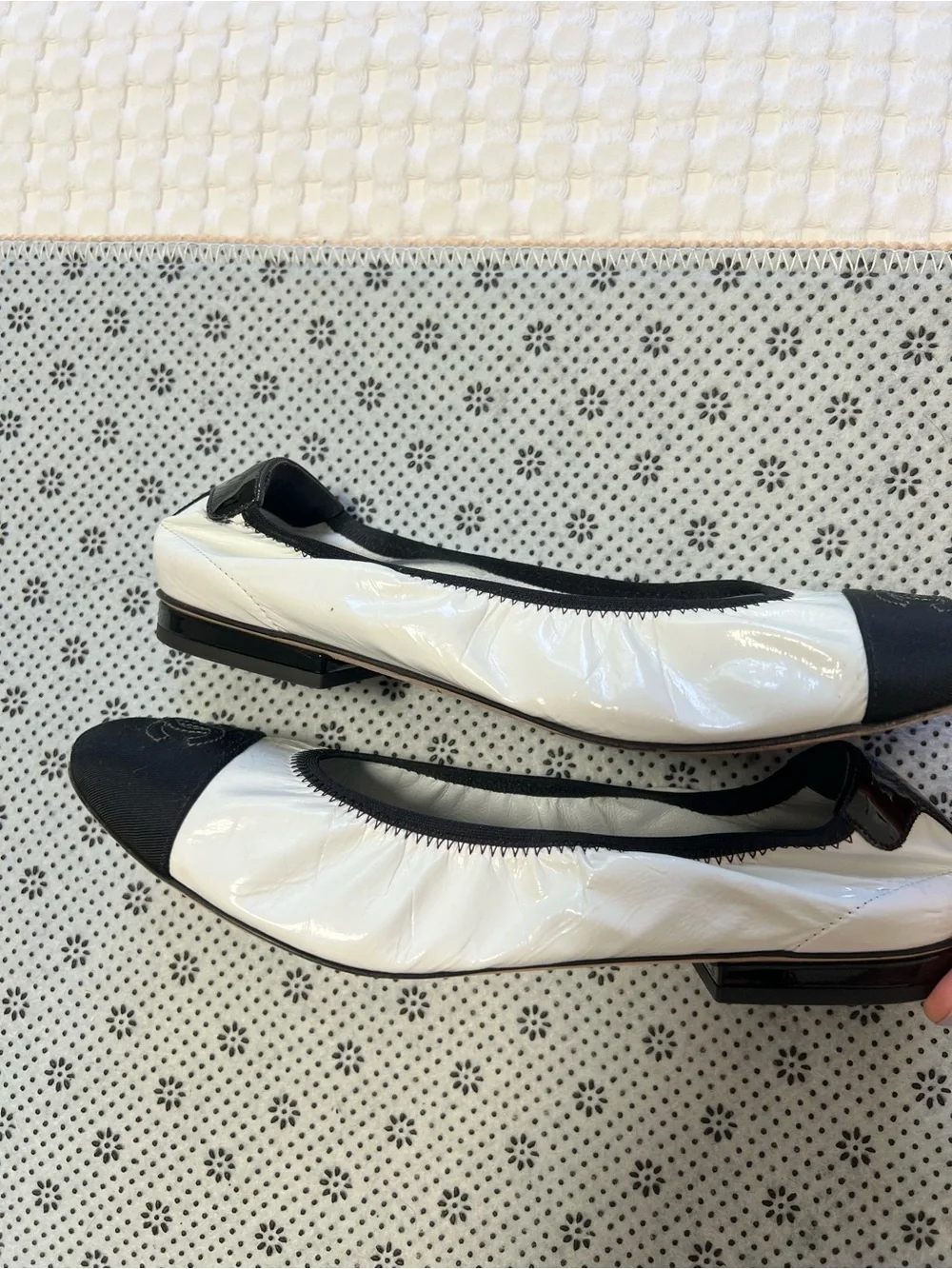 CHANEL White Ballet Flats with Black Cap Toe
