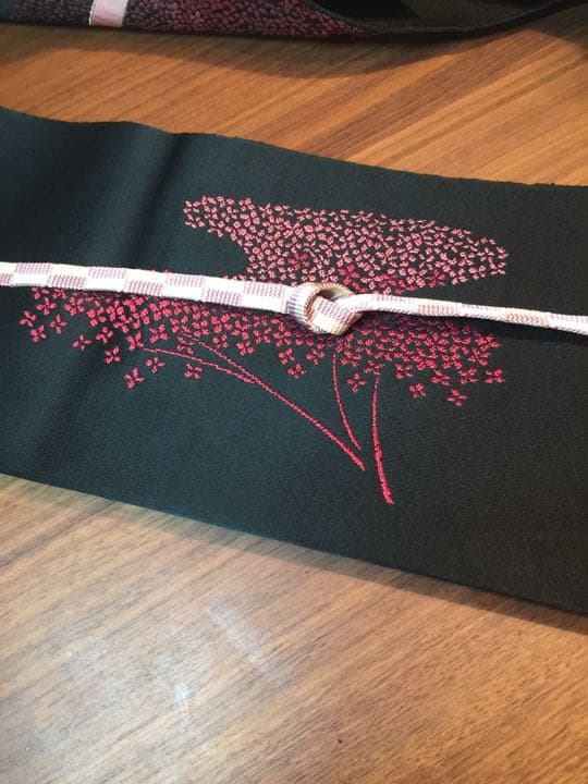 This obi features a cherry blossom pattern and is currently in season.