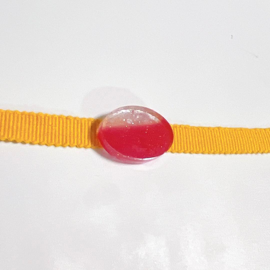 Oval-shaped red and clear obi clasp (with metal fitting)