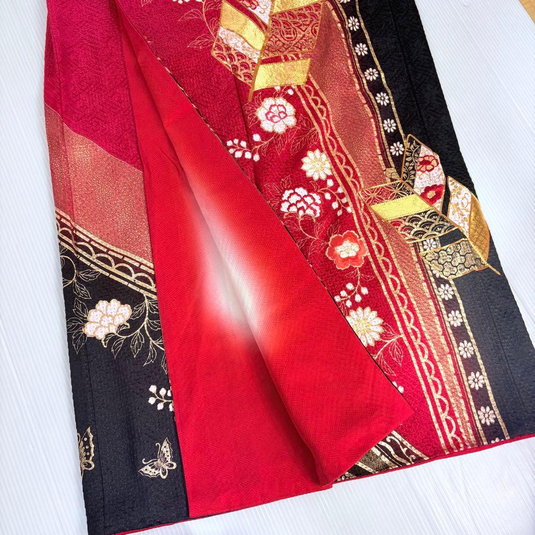 Furisode (long-sleeved kimono) with total shibori (tie-dye), gold leaf, gold thread embroidery, and classic patterns