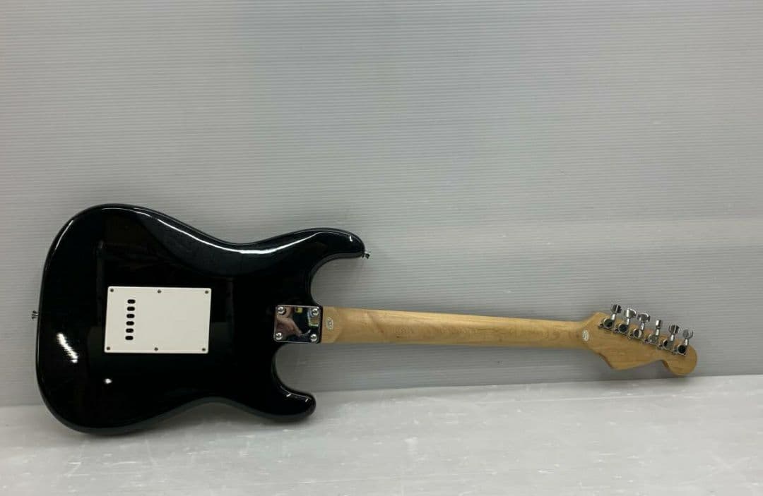 Electric guitar, black, left-handed, with strap